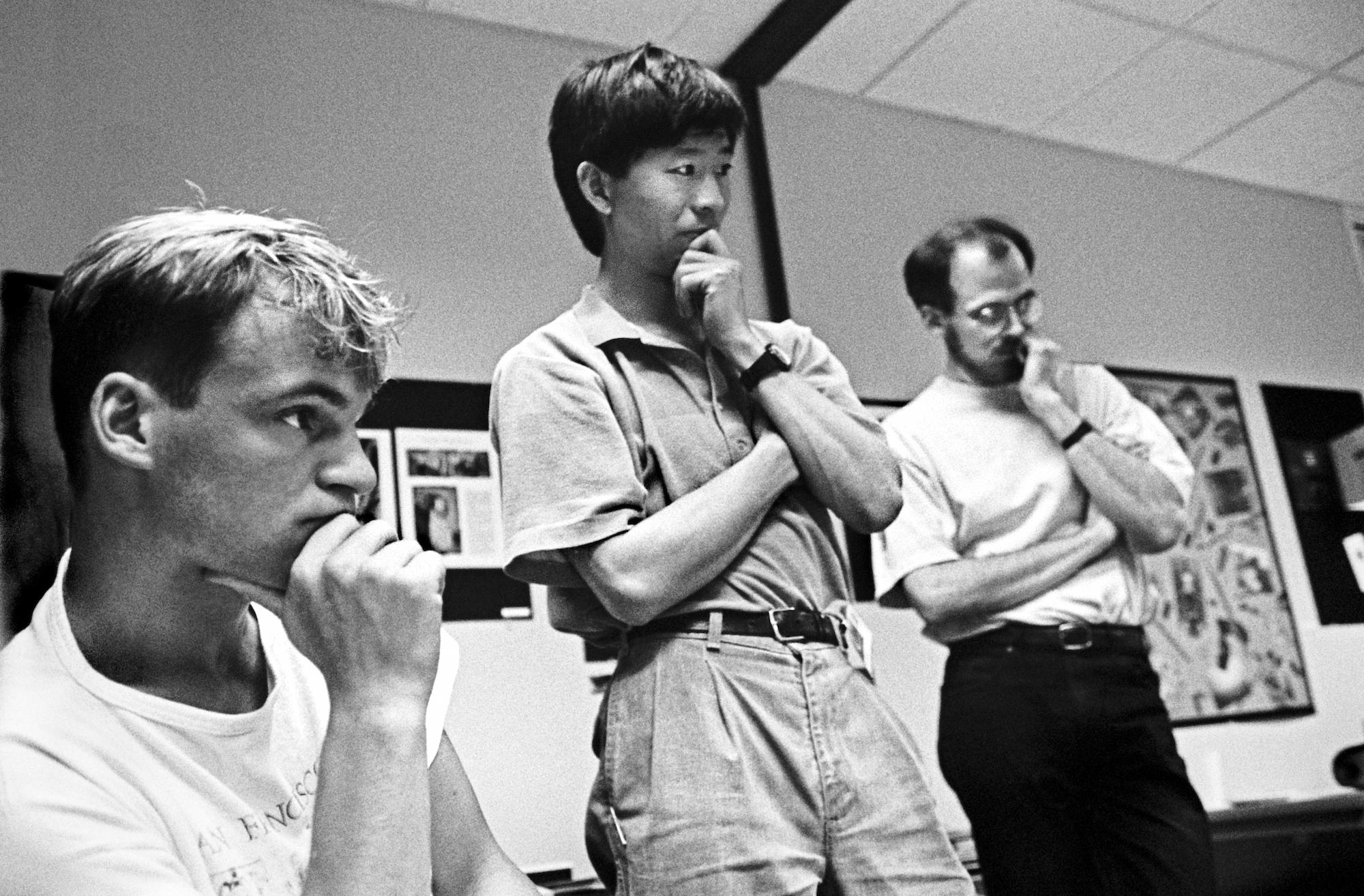 At the 1990 Adobe Photoshop Invitational, members of Adobe's creative team (back row, from left)_ Min Wang and Russell Brown along with an unidentified artist, 1990