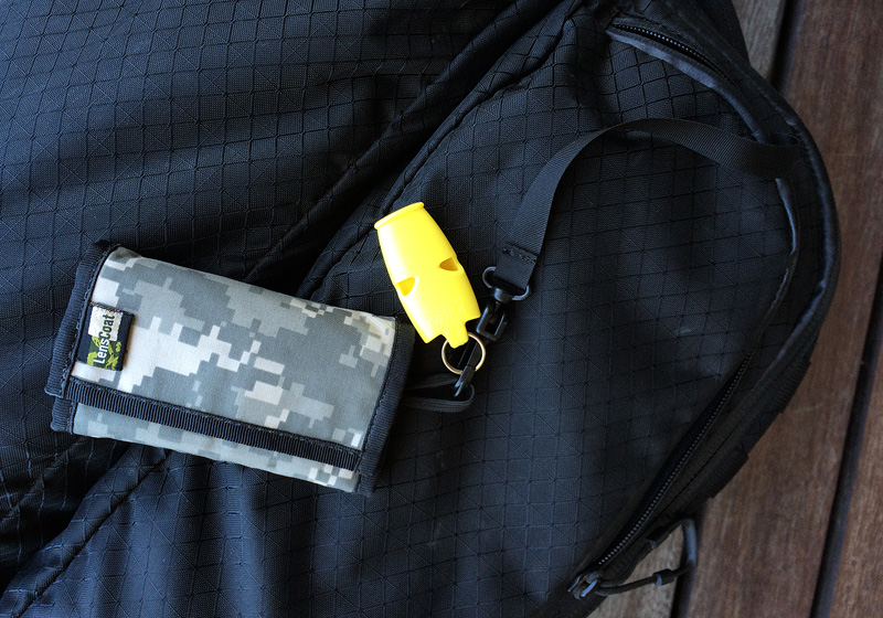 The built-in lanyard with my LensCoat card wallet and emergency whistle.