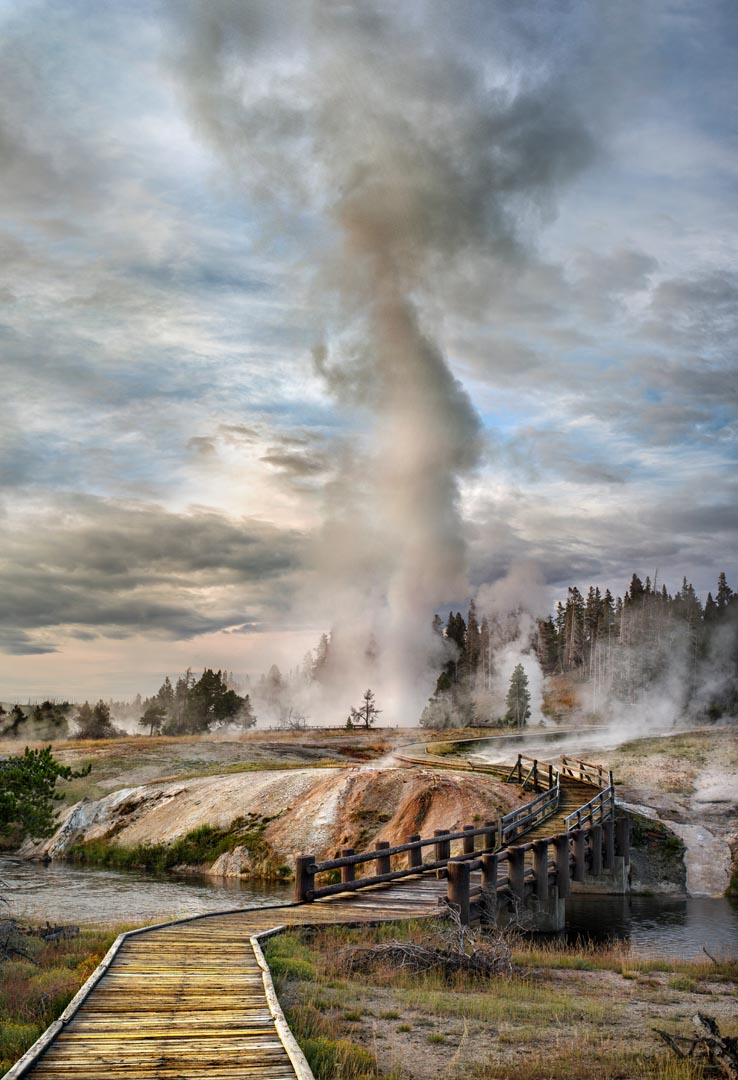 Grand Geyser erution, geothermal basin and pool near Old Faithful area, Yellowstone National Park