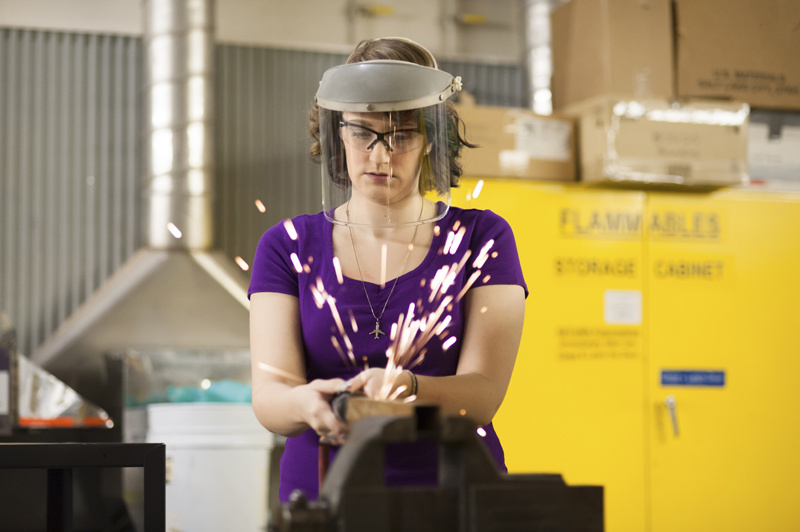 Woman welding.