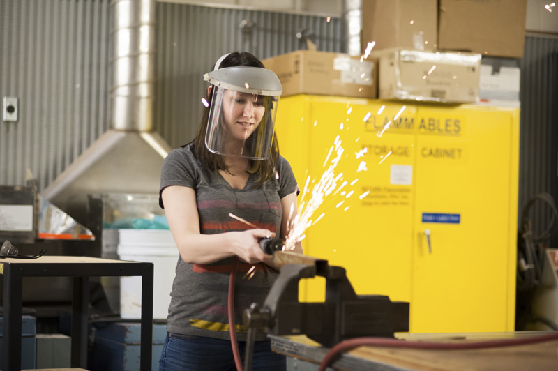 Woman welding.