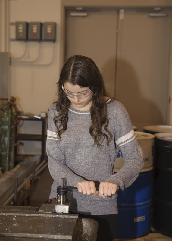 Woman working with tools.