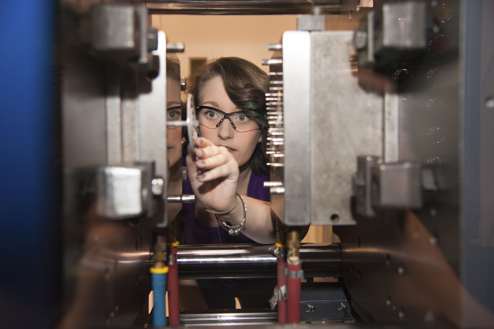 a woman working with machinery