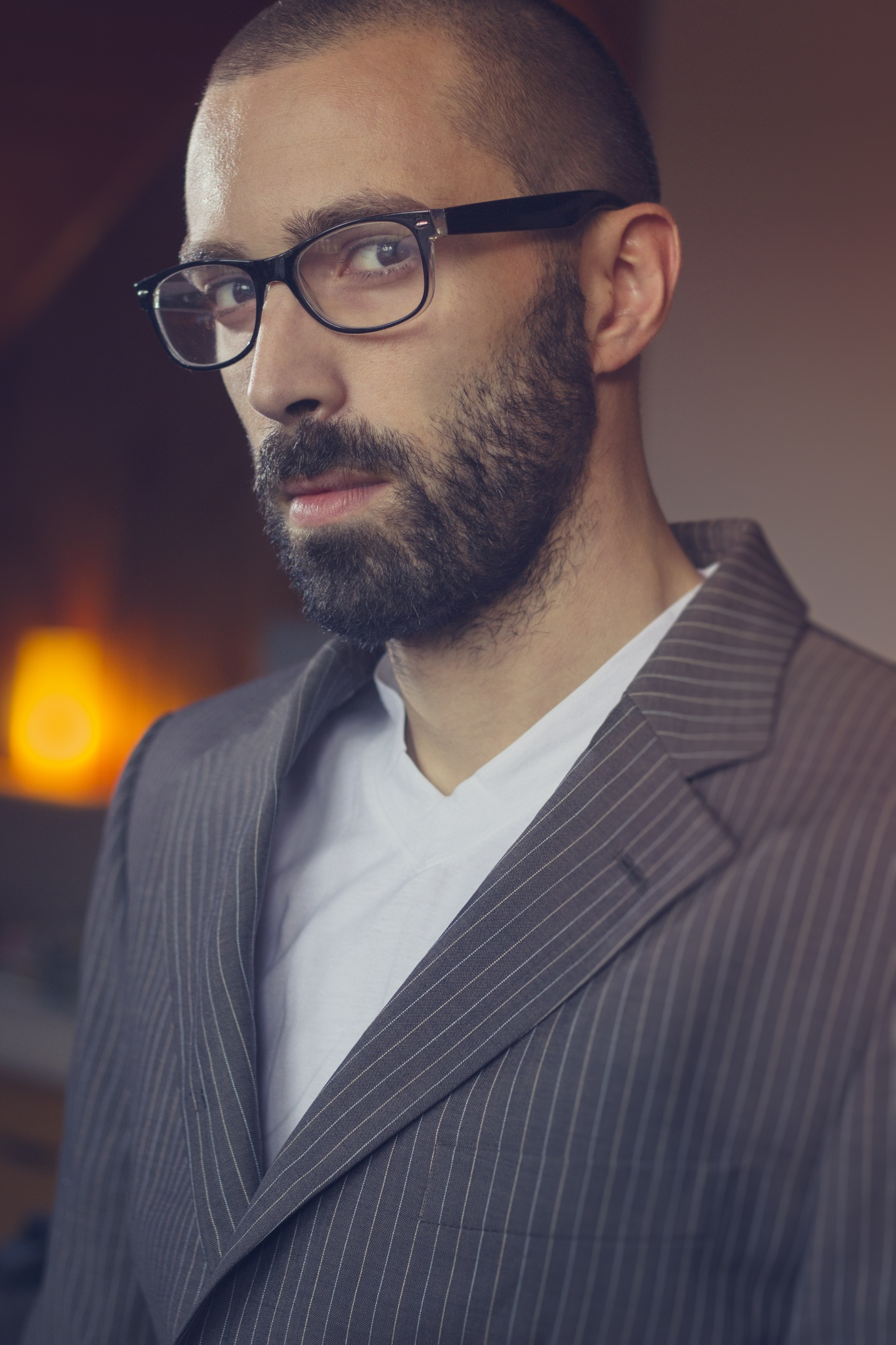 Handsome man in a suit weaing glasses