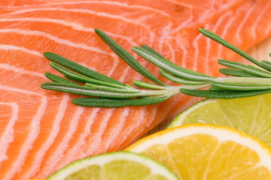 Closeup of salmon steak with rosemary.