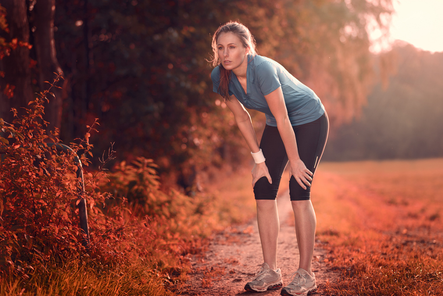 Young athletic woman taking a break from training