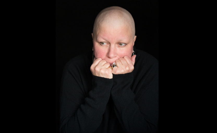 Female ovarian cancer patient looks on with fear and uncertainty; healthcare photographer; pharmaceutical; cancer; chemotherapy