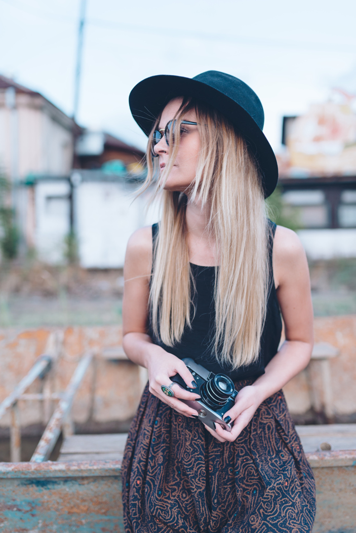 Girl with analog camera outdoors