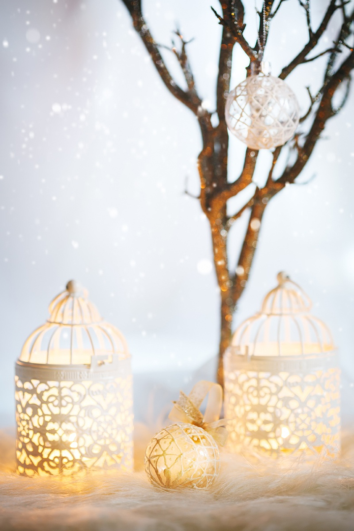 White Christmas card. Decoration with lanterns. Vintage, retro composition. Selective focus on white bauble.