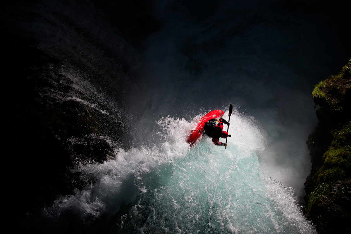 Woman kayaking in rushing white water