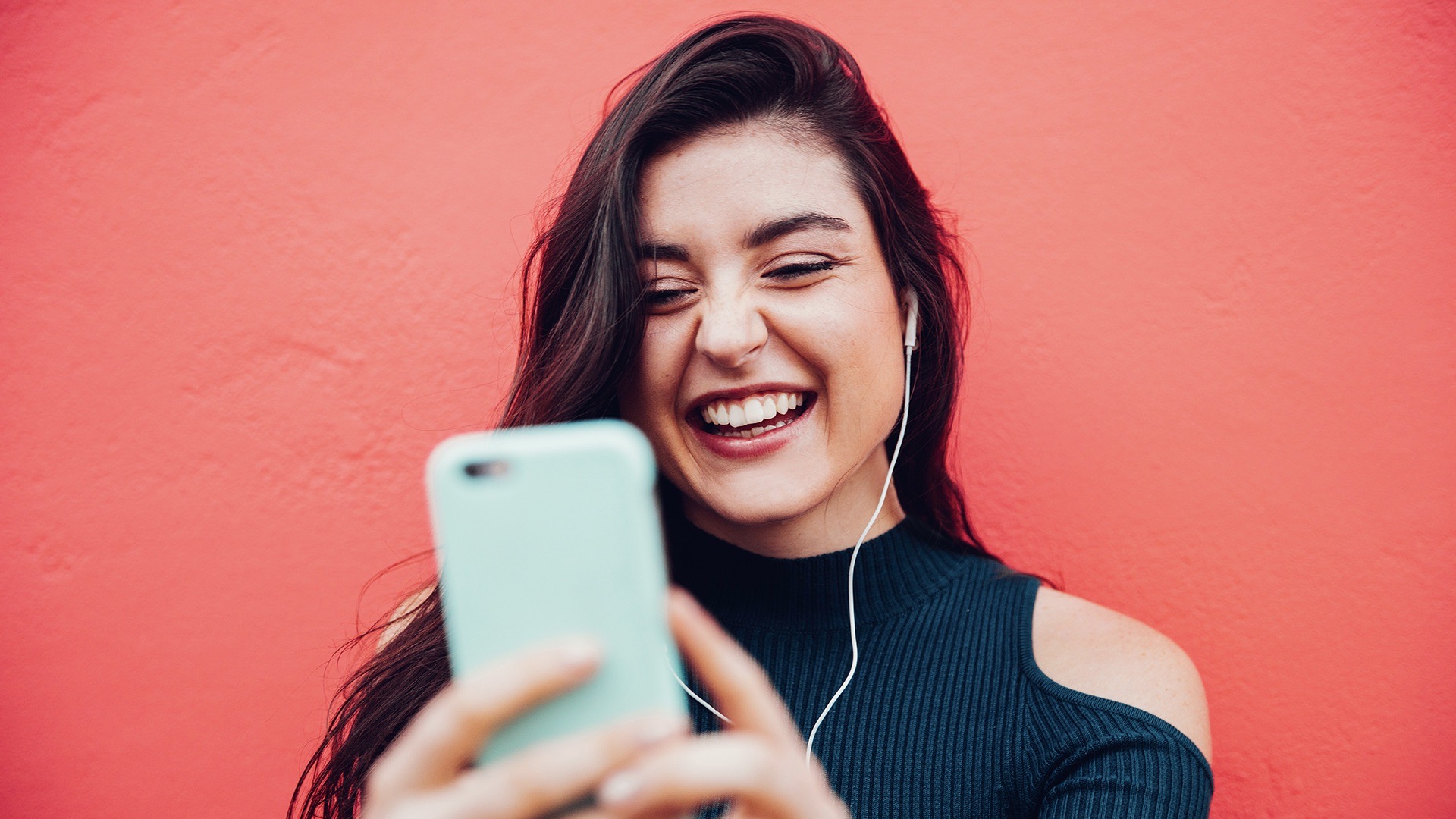 Young women video chatting with smart phone - 500px