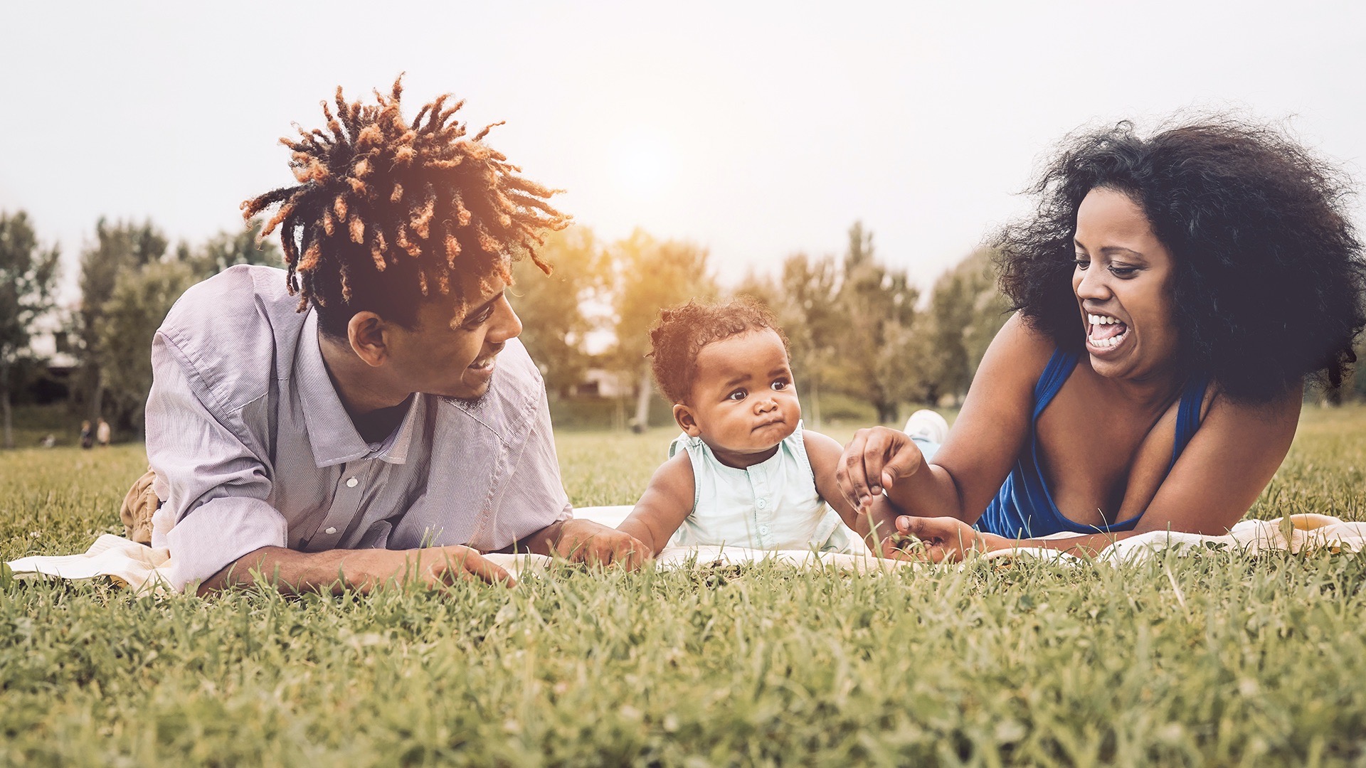 Happy African family enjoying together a weekend sunny day By Alessandro Biascioli