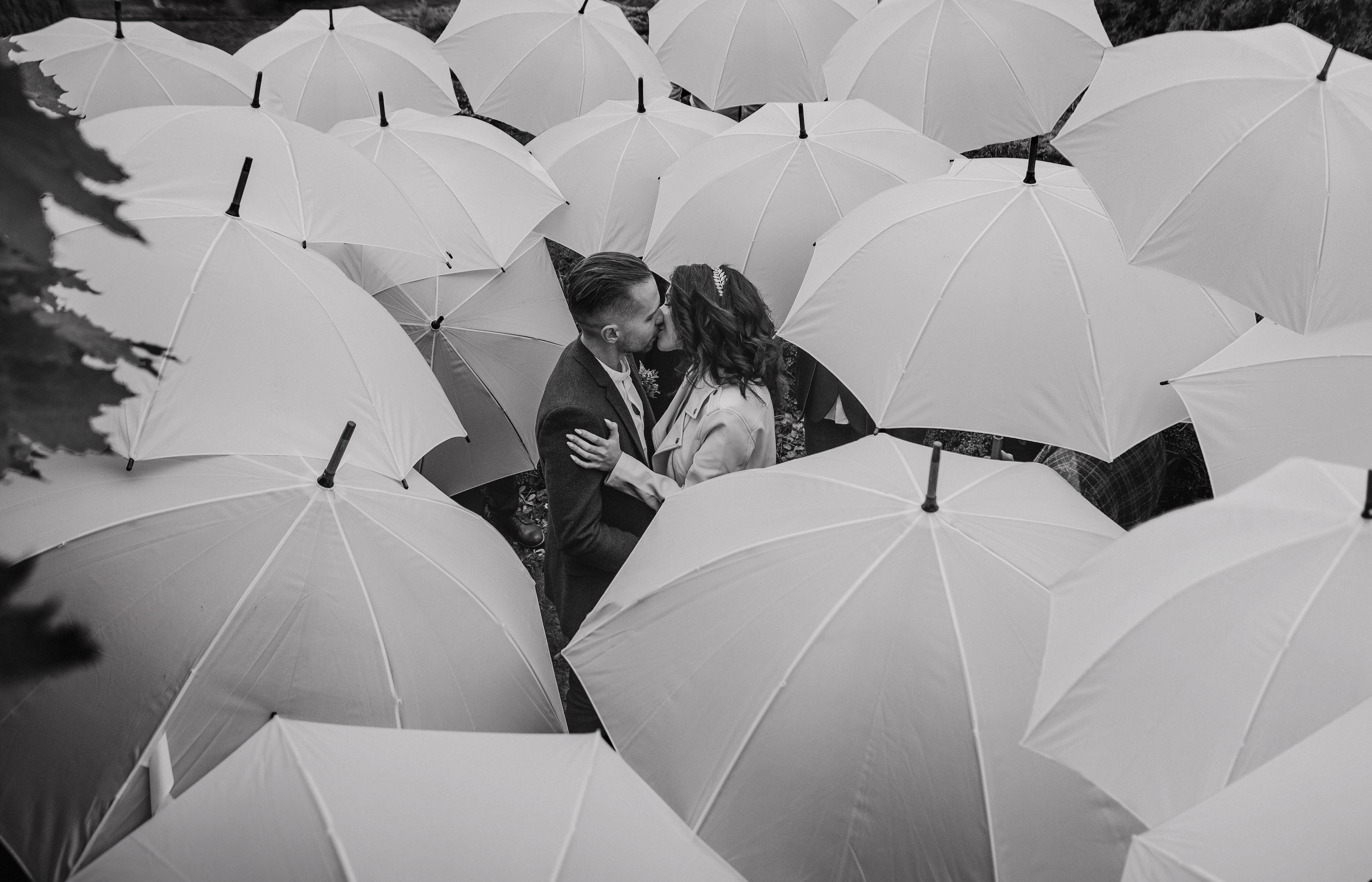 stock photo couple love rainy weather group people umbrellas 1031974771