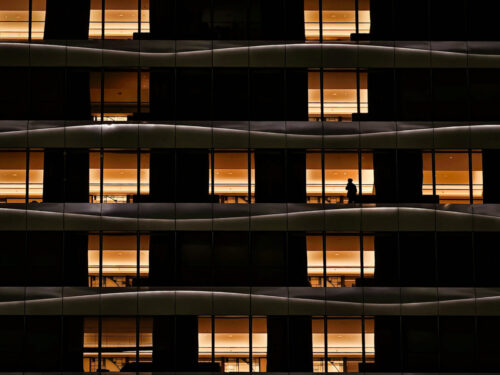 Observing light, repetition, and human scale in urban architecture, showcasing photography practice tips for visual storytelling.