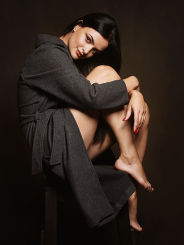 Studio portrait with controlled lighting and pose, showcasing a refined photography workflow from concept to final image.