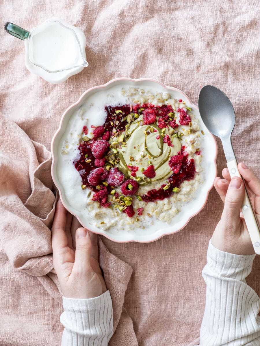 Everyday light photography of a breakfast bowl with raspberries and yogurt in soft natural light