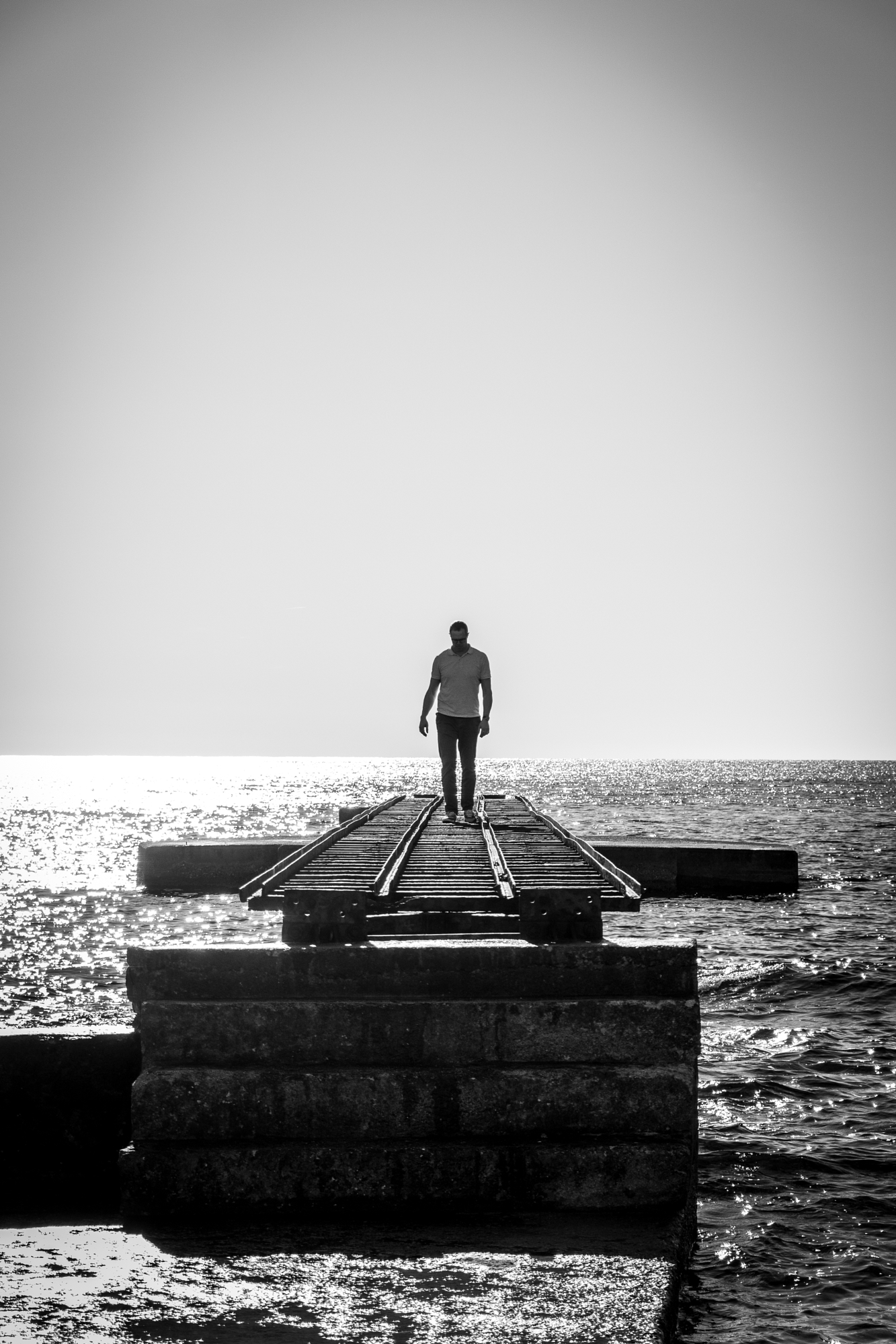 Solitary Walk On Wooden Pier by Cenk Salfur