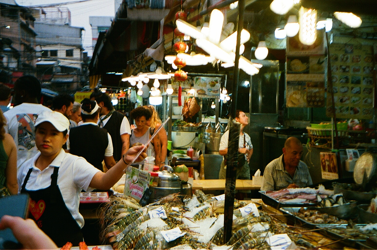 Night market in Bangkok by Filip Chmielecki