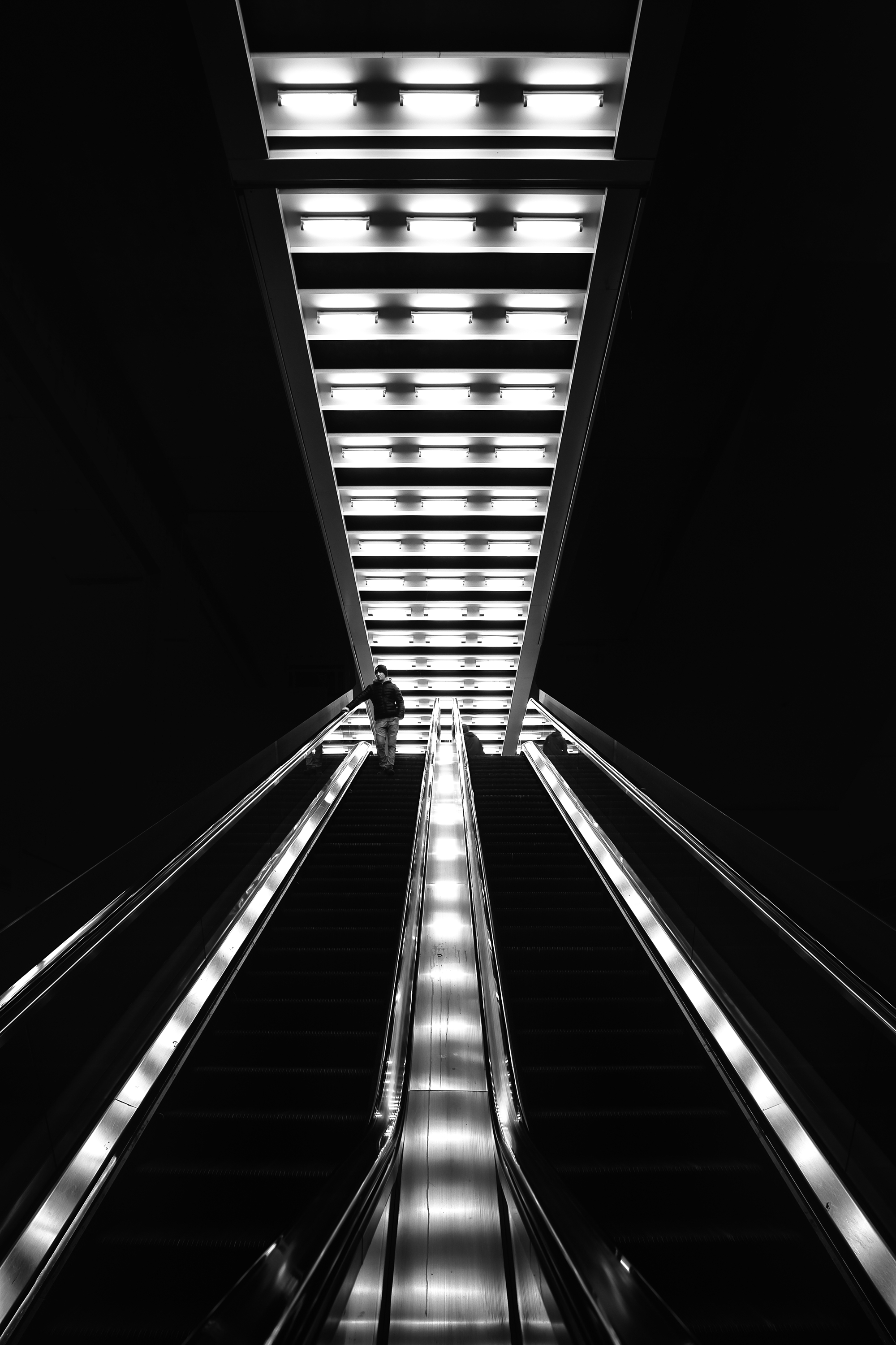 Fine art photography interview featuring a lone figure on an escalator.