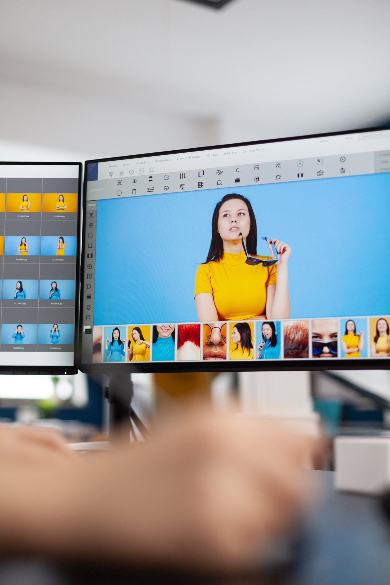 Close-up of a professional retoucher using a stylus and graphic tablet for manual, traditional photo editing to avoid prohibited AI generative modifications.