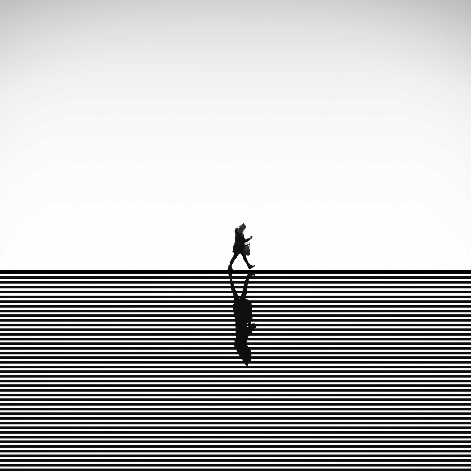 Minimalist photography techniques using stripes and a silhouette.