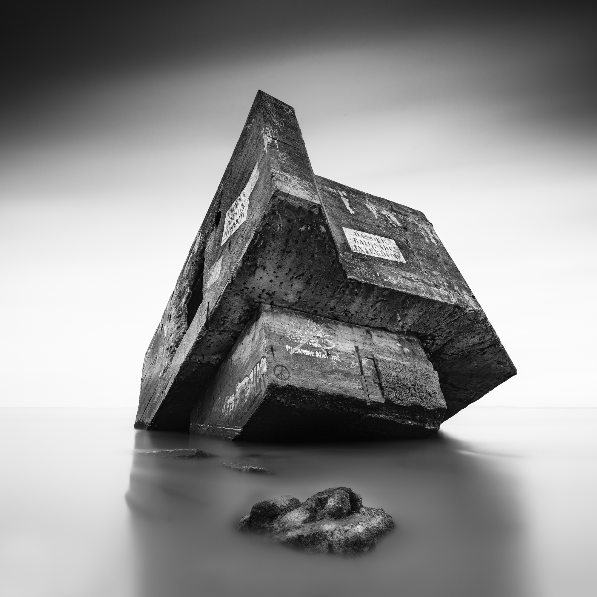 Neutral density filter landscapes featuring a concrete sea bunker.