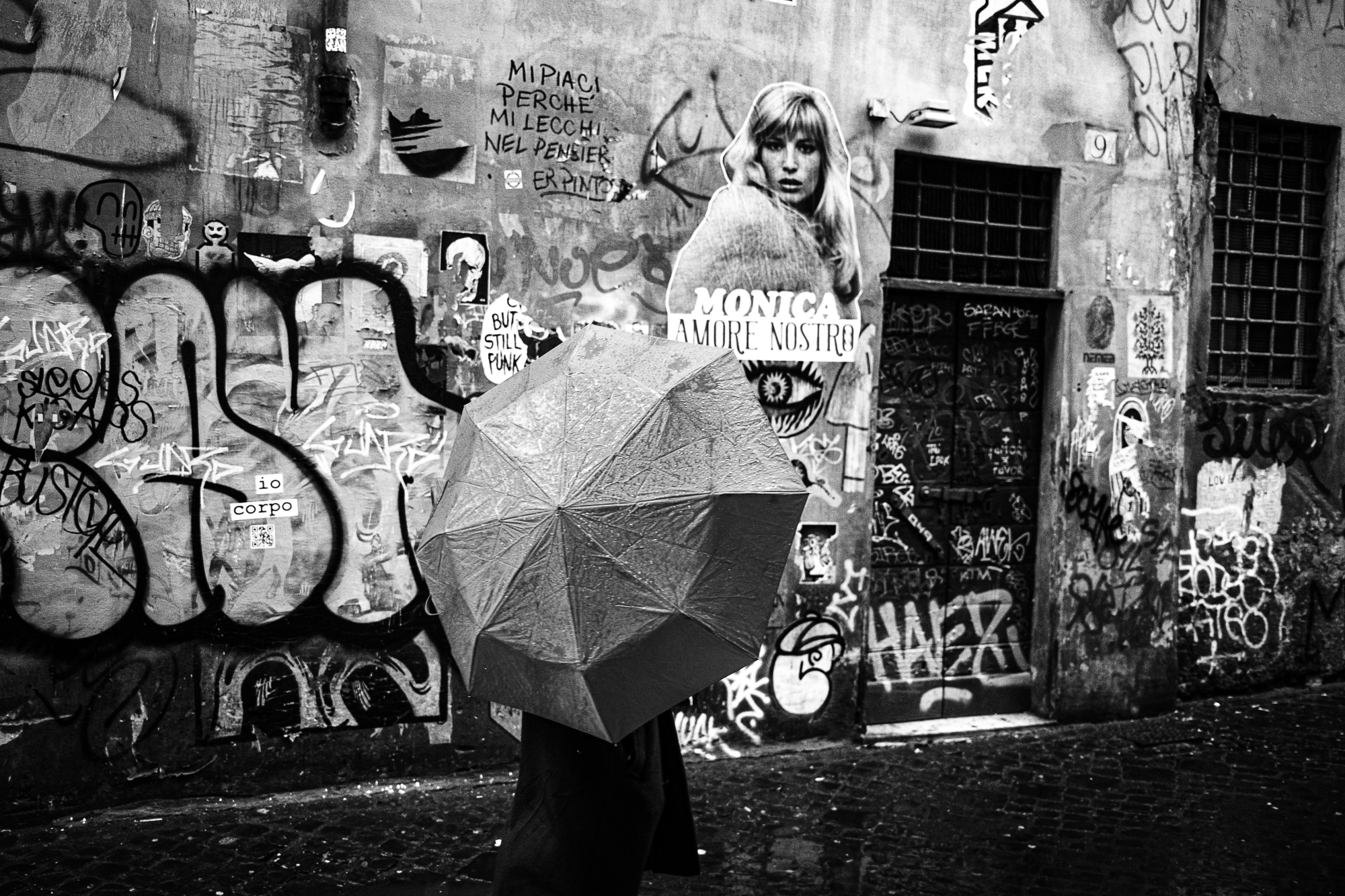 Black and white urban photography capturing an authentic human element on the street.