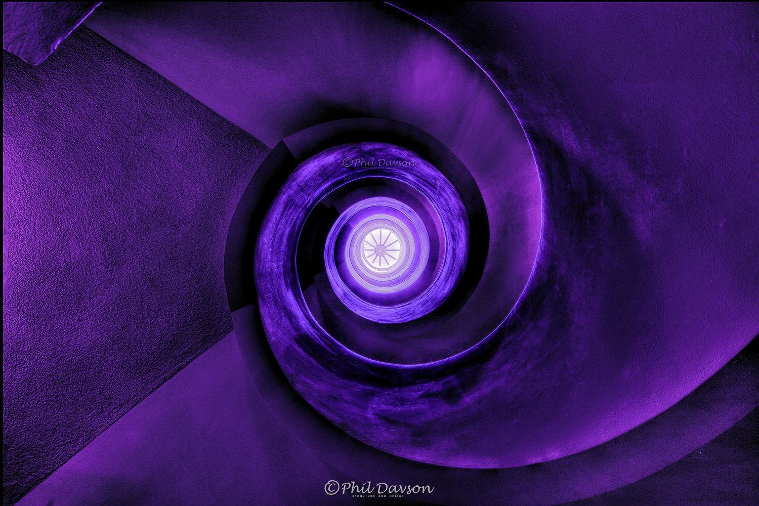 Creative abstract spiral perspective of an indoor staircase structure.